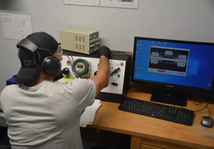 QTC technician running an ECS component on the test bench