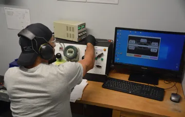 QTC technician running an ECS component on the test bench