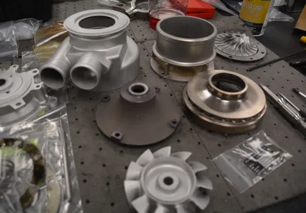 Disassembled air cycle machine components during overhaul