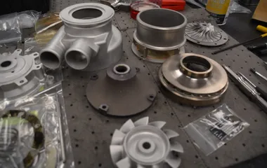 Disassembled air cycle machine components during overhaul